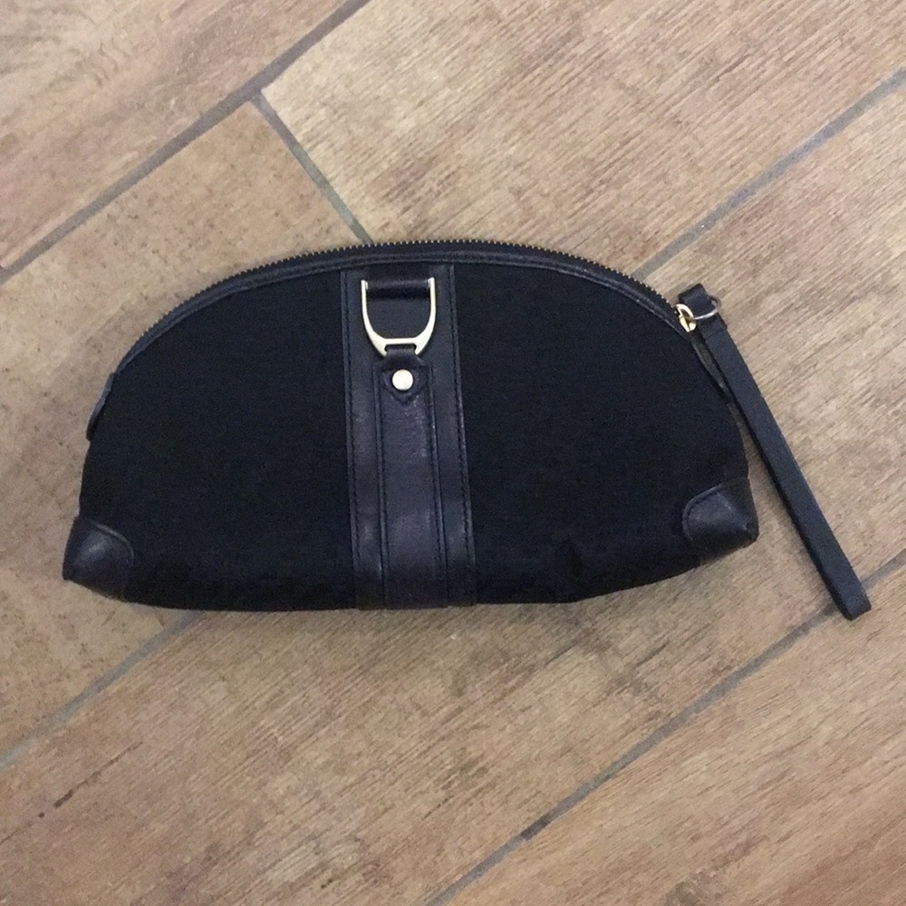 Cole Haan black cosmetic bag.